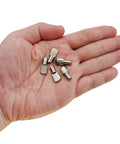 Nickel Plated Shelf Pins Set Of 50 5mm Diameter Fits 1/5 Inch Holes shown in hand for scale, ideal for cabinets and shelves