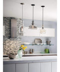 Modern kitchen with Dope Antique Bronze Champagne Glass Pendant Light With Vintage Woven Cloth Cord, Parisian Boutique Inspired Chess Piece Silhouette hanging.