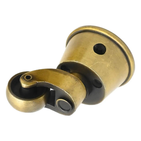 Close-up of a Vintage Zinc Alloy Swivel Caster, 1-3/4 Inch OD, Antique Brass Bronze Finish, showing wheel and mounting cup.