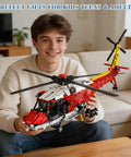Person holding Rescue Helicopter Building Block Set With 1528 Pieces And Motorized Rotors Realistic Gear System Transport Copter Toy For Adults And Kids Collectible RC Army Airplane Model Kit Ages 8 And Up