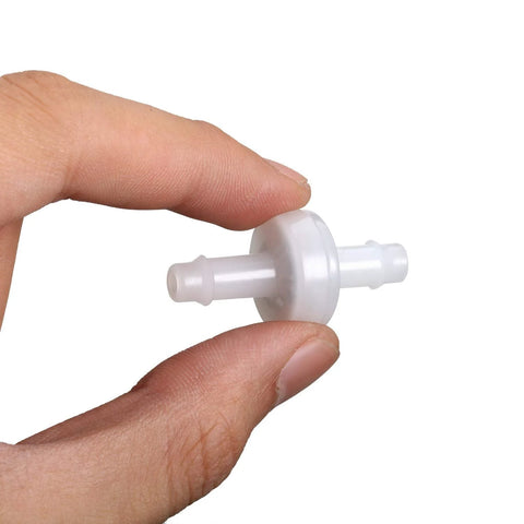 Close-up of PVDF plastic one-way check valve, 6 mm, white, held between fingers