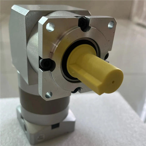 Heavy Duty Slick 90mm Planetary Speed Reducer Gearbox With 40 To 1 Ratio close-up view showcasing yellow output shaft and aluminum housing.