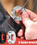 No Sweat Road Warrior Bike Repair Kit featuring five universal spoke wrenches in use on a bicycle wheel for rim adjustments.