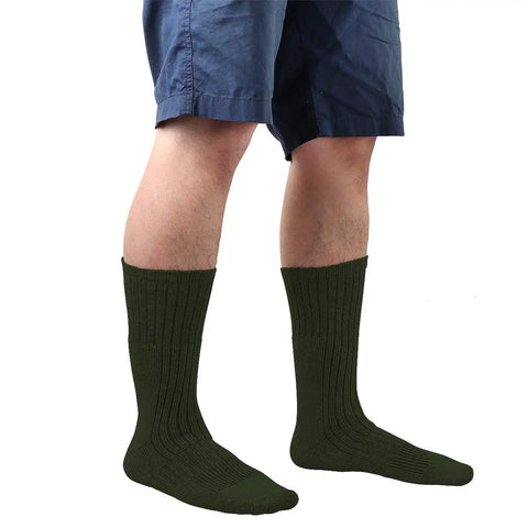 Man wearing Heavy Duty Military Grade Boot Socks 4 Pack For Combat Training Trekking And All Day Work Duty in green