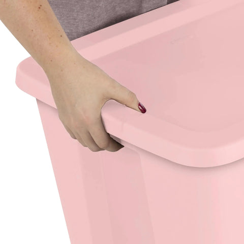Person holding the edge of a Pink 18 Gallon Storage Bin With Secure Snap On Lid Heavy Duty Stackable Plastic Tote.