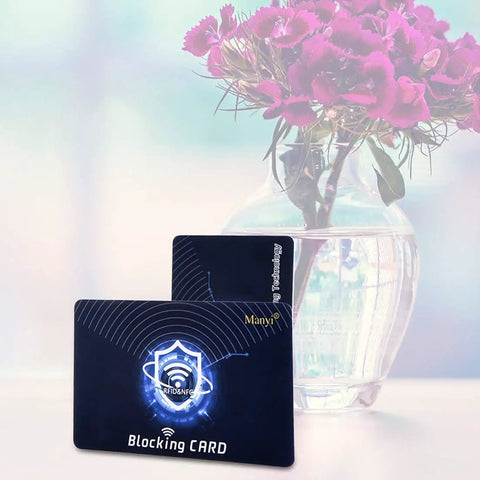 RFID Blocking Card 5 Pack Shield for Wallets and Purses next to pink flowers in a vase