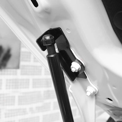 Close-up of Subaru Crosstrek 2024 Front Hood Lift Supports, stainless steel hood shock attachment, gas springs detail.