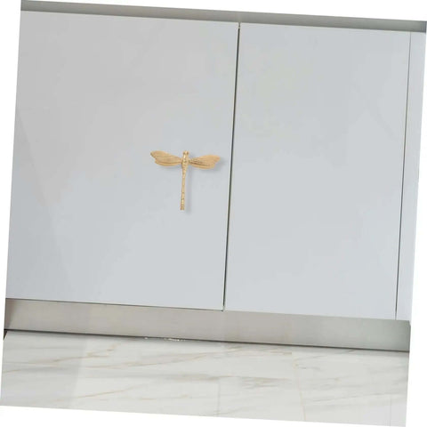 Dope Antiqued Brass Dragonfly Cabinet Knobs With Slick Pull Action For Kitchen Cabinets And Drawer Fronts on white cabinets.