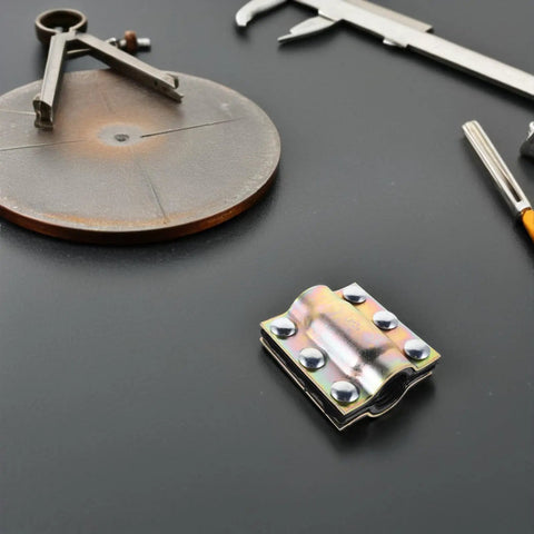 Waterproof Pipe Repair Clamp for DN20-110 Pipes surrounded by engineering tools on black surface