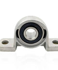 Built Tough Four Piece KP08 KP000 To KP006 Bearing Shaft Support Kit Using Zinc Alloy Spherical Roller Housing Designed For Vertical Pillow Block Mount Up To Keep Everything Rolling Smooth Like Butter In Your Shop, front view