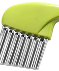 Close-up of lime-green plastic-handled crinkle cutter with stainless steel wavy blades for potatoes and carrots.