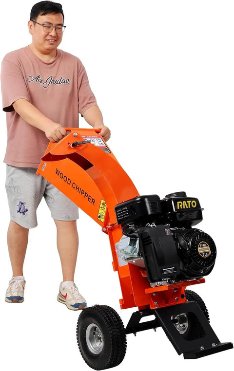 Person using Rugged 7HP Gas Powered Wood Chipper Shredder Mulcher with 3 Inch Capacity and 212cc OHV Engine for landscaping