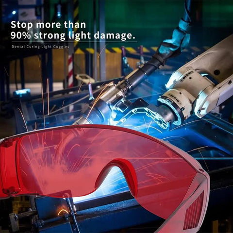 Anti Fog Dental Safety Glasses Ultra Lightweight Protective Eye Shields For Teeth Whitening Lights And Lab Work Fits Over Prescription Frames No Sweat Ventilation Built Tough For Range And Workshop Sweet Spot Comfort Red Lens Option with robotic arm and sparks background.
