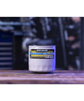 High Performance Oil Filter 858004Q For MerCruiser Sterndrive And Inboard Engines with label on wooden surface