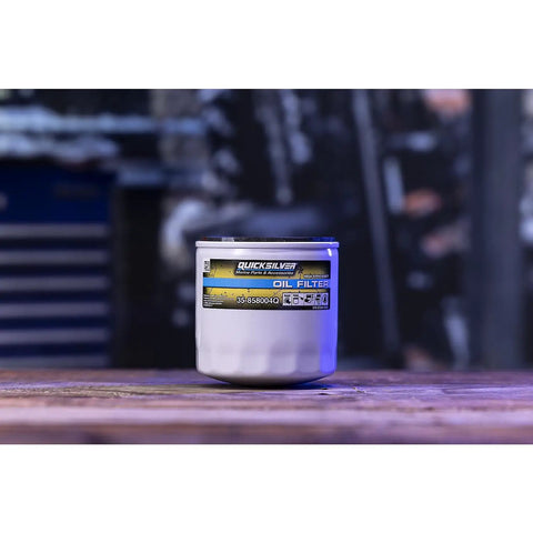 High Performance Oil Filter 858004Q For MerCruiser Sterndrive And Inboard Engines with label on wooden surface