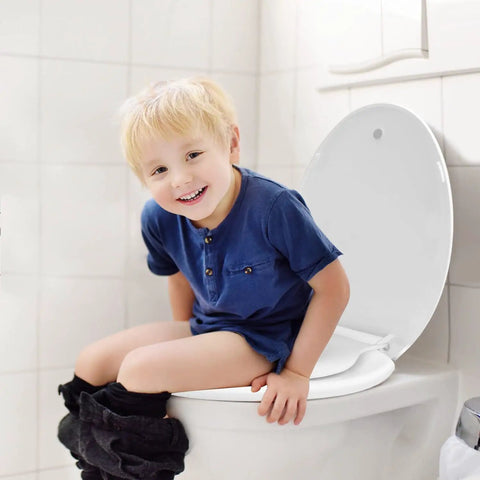 Child sitting on elongated toilet seat with built-in toddler seat and soft close for easy potty training family friendly white design.
