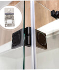 Glass door hinge for wine cabinets; black clamp hinge with screws installed on glass panels