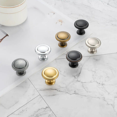 Oil Rubbed Bronze Round Cabinet Knobs One And A Quarter Inch Ten Pack Solid Metal Drawer Pulls For Kitchen Cabinets Dressers Cupboards Bedrooms And Bathrooms Remodel Up Your Space With A Clean Modern Look displayed with multi-color variations on a marble surface