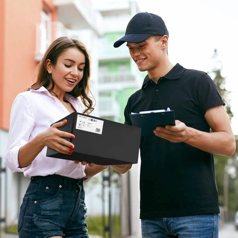 Person receiving a package with black 14.5 by 19 inch poly mailers 100 pack thick self sealing waterproof tear resistant shipping bags for clothing and boutique packaging opaque with gray lining perfect for ecommerce shipping of clothes and accessories in style with matte exterior.