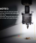 Close-up Mollom carbide hole saw (1-1/4 in / 32 mm) with two pilot bits in a drill chuck