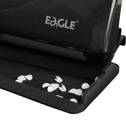 Close-up of black Low-Force No-Fuss 3-Hole Punch For 20-Sheet Capacity, Heavy-Duty Desktop Paper Punch with punched holes visible.
