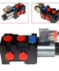Front view of 13 gpm hydraulic solenoid selector/diverter valve with black housing, red caps, and silver motor.