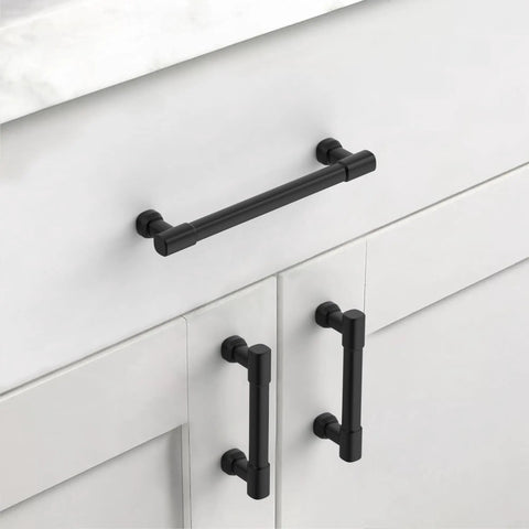 Upgrade Your Kitchen Game With Slick Matte Black Cabinet Pulls And 5 Inch Drawer Handles Heavy Duty 10 Piece Set of black metal cabinet handles on white cabinets.