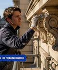 Person on scaffold using Top-Notch 10 Pack Wall and Trim Paint Brushes Set for Pros and DIYers Includes 2 Each of 1, 1.5, 2, 2.5, and 3 Inch Angled Sash Brushes Great for Cabinets, Decks, Fences and Both Interior and Exterior Jobs on building corniche