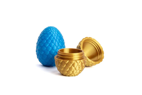 Blue and gold-scale decorative containers showcasing possible prints from MK4S 3D Printer Kit With Automatic Calibration And Removable Sheets.