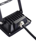 Close-up view of JUDYSSY 10W Led Flood Lights showing black cast aluminum body and wiring for secure installation.