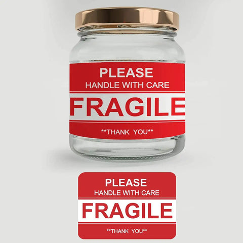 Fragile Stickers 2x3 Inches For Shipping And Moving With Permanent Adhesive 500 Labels On One Roll displayed on a glass jar