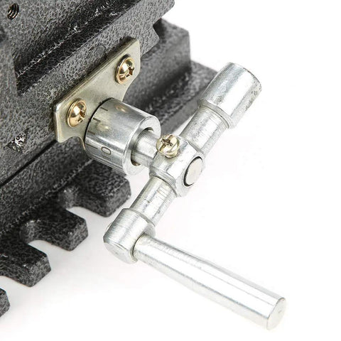 Beefy 4 Inch Cross Slide Vise With Heavy Duty Clamping Power For Milling Machines And Drill Presses Steel Construction Wide Jaws For Secure Workpieces And Precise Cuts Ready For Any Heavy Metal Working Project, close-up handle and jaw mount