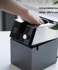 Slick Automatic Coffee Portafilter Cleaner And Espresso Grounds Knock Box Station Featuring Smart Optical Guard in use on countertop.