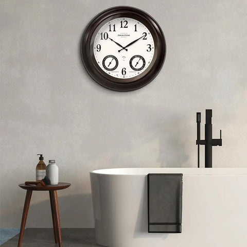 24 Inch Self Illuminated Outdoor Clock With Weather Station Thermometer And Hygrometer Waterproof Metal Clock In Oil Rubbed Bronze Finish Modern Farmhouse Style Night Light Auto Brightness Sensor mounted on bathroom wall.