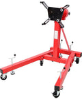 Heavy Duty 1500 Lbs Engine Stand Featuring Smooth Geared 360 Spin Foldable Motor Hoist with red steel V frame and four locking casters.