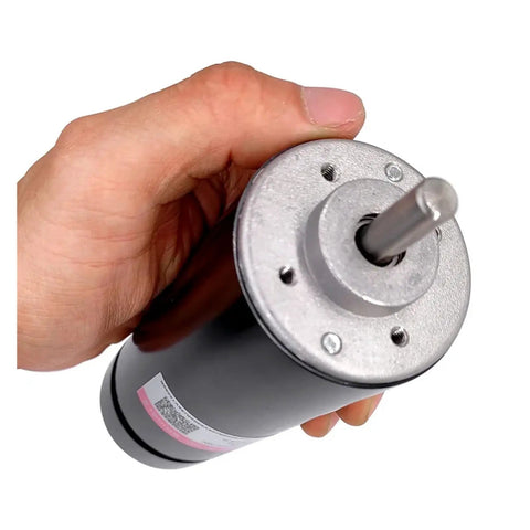 Built Tough 500W Air Cooled Spindle Motor For CNC Router With ER11 Chuck and 48V DC Power in hand, showcasing metal construction.
