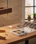 21-Piece Hanger Bolt Kit With Driver Tool for Furniture Leg Assembly on a table, showing double-ended screws and drill driver