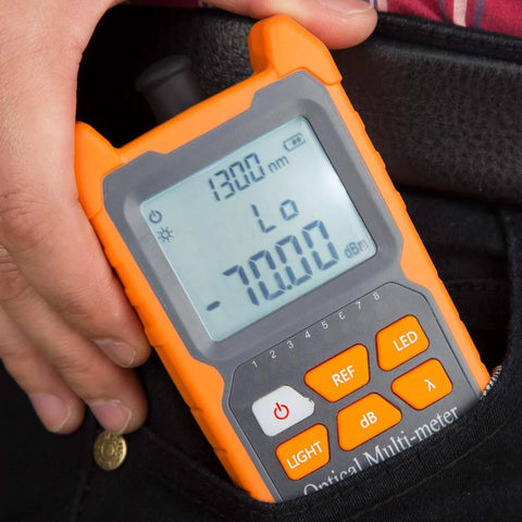 Front view of orange handheld optical fiber power meter with LCD display and orange keypad