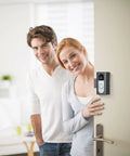 Couple using Anti-Theft Video Doorbell Mount For Most Video Doorbells Easy Install No-Drill Bracket on apartment door