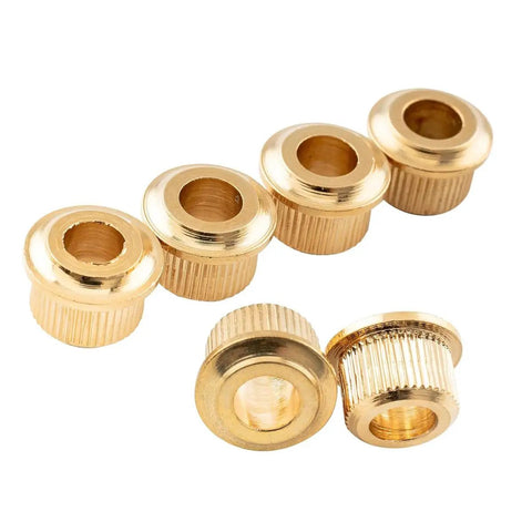 Six gold knurled adapters from Must Have Six Piece Gold Guitar Tuner Conversion Bushings Kit For Vintage To Modern Machine Heads Converts 6mm Posts To 10mm Drilled Headstock Bore For 6 Inline Or 3 On Each Side Knurled Tuning Pegs Adapter, viewed from above.
