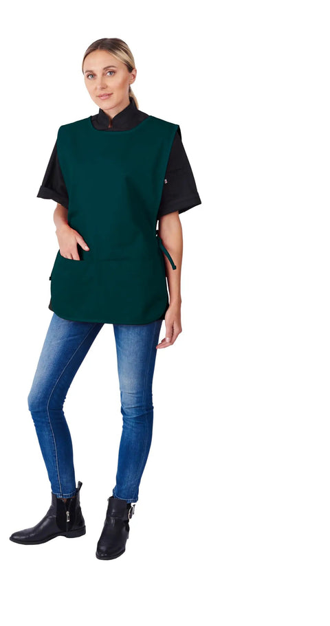 Rugged Cobbler Apron With Two Deep Pockets Cut From Smooth Poly Cotton Twill Featuring Adjustable Side Ties, worn by a model.