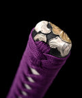 Close-up of decorated katana handle wrapped in Purple Silk Sageo Ito Wrap Cord For Katana Wakizashi And Tanto Handles, Synthetic Silk Cotton 400cm