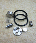 Waterjet check valve repair kit: stainless fittings, black O-rings, spring, discs; front view