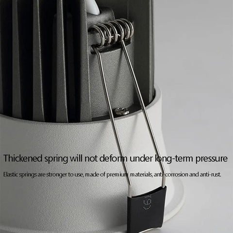 Close-up of UWYTGF 9 Pack Retrofit Led Recessed Lighting 3.2 Inch spring mechanism, highlighting durability and material quality.