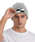 Man wearing Dope Black And White Grid Pattern Knit Beanie Hat For Winter Super Cozy Acrylic Skully Cap.