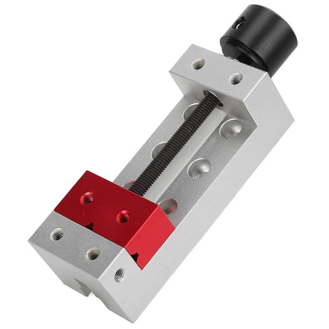 Compact Aluminum Mini Bench Vise For Woodworking Hobbyists, A Handy Little Table Clamp With 50mm Jaw Range, 123mm Overall Length, 20mm Mount Hole Distance, Ideal For Engraving, Drilling, And Small Repairs, shown angled open with red jaws