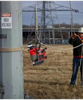 Worker using No Sweat Cordless Magnetic Drill Kit For Professional Linemen Featuring A Heavy Duty Brushless Motor And One Point Five Inch Capacity on a utility pole.
