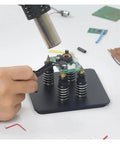 Person using Pro Grade Magnetic Soldering Station With Flexible Third Hand Bracket for electronics repair