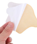 Game Changing Heel Grips And Liner Cushions To Tighten Up Loose Shoes Anti Chafing Beige Shoe Inserts. Hand holding cushion.