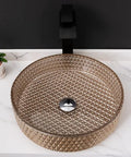 Modern Rectangular Tempered Glass Vessel Bathroom Sink Slick Finish, round basin with textured surface and sleek faucet.